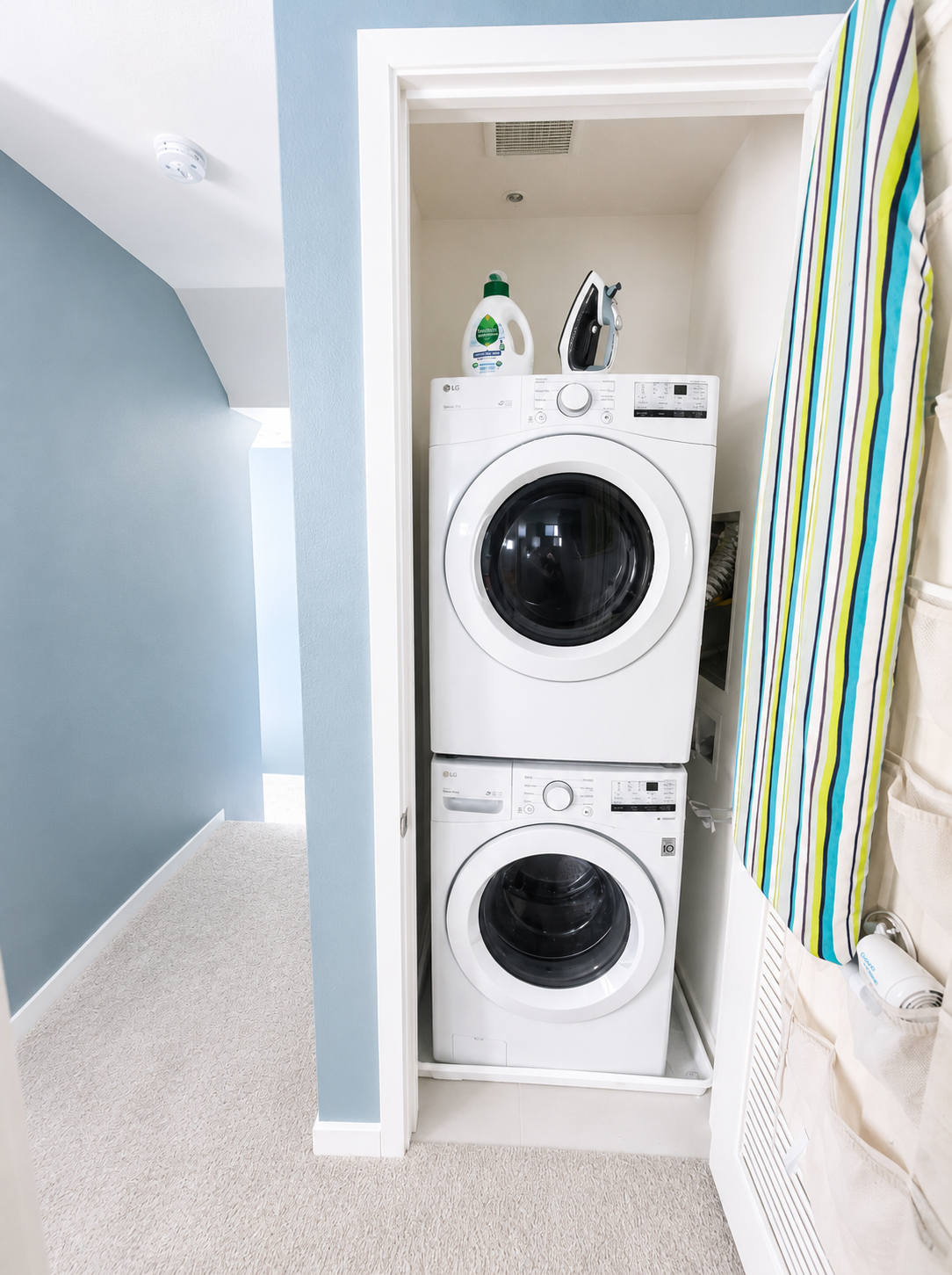 In-unit stacked washer and dryer